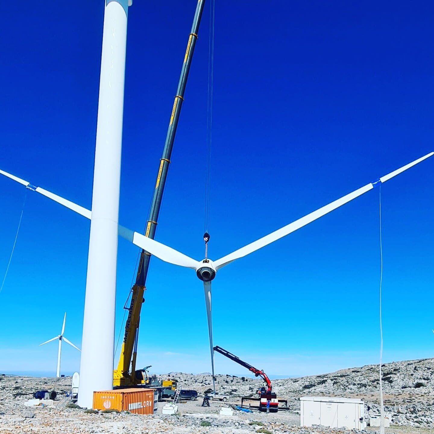 Rafale Energy technicians performing blade repair on wind turbines in Italy — coastal wind park